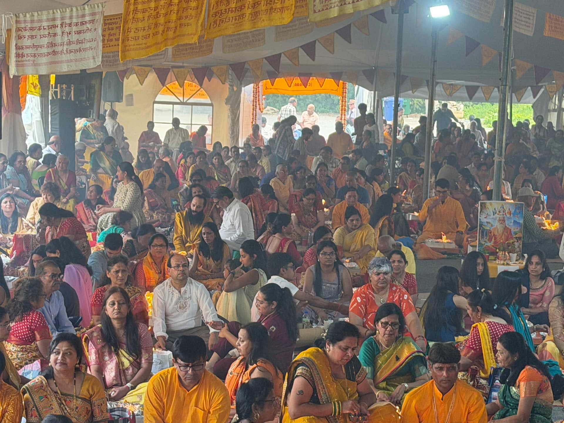 Hundreds of devotees seated at the yagna kunds