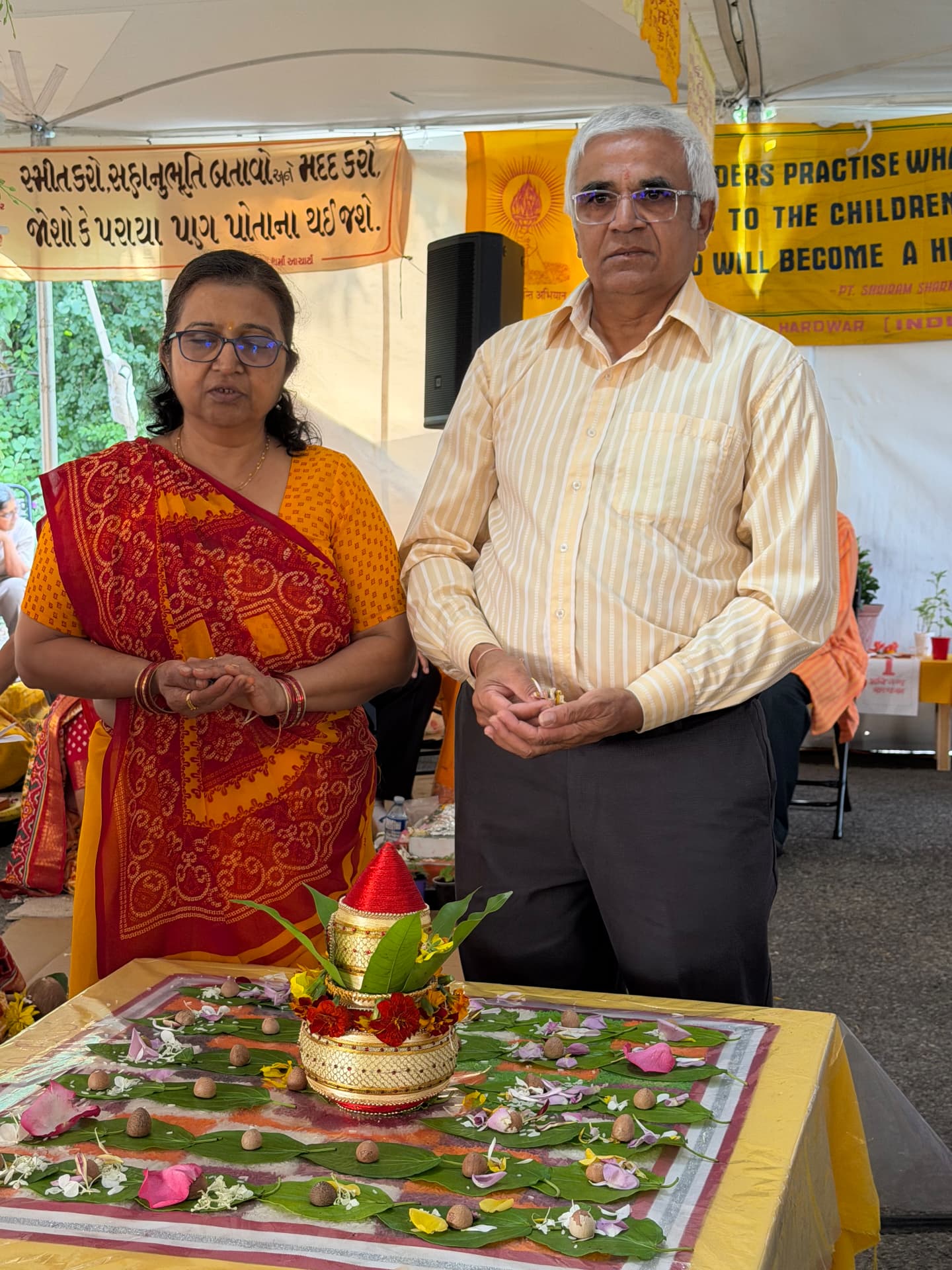 Devotees making offerings during the sankalp ritual