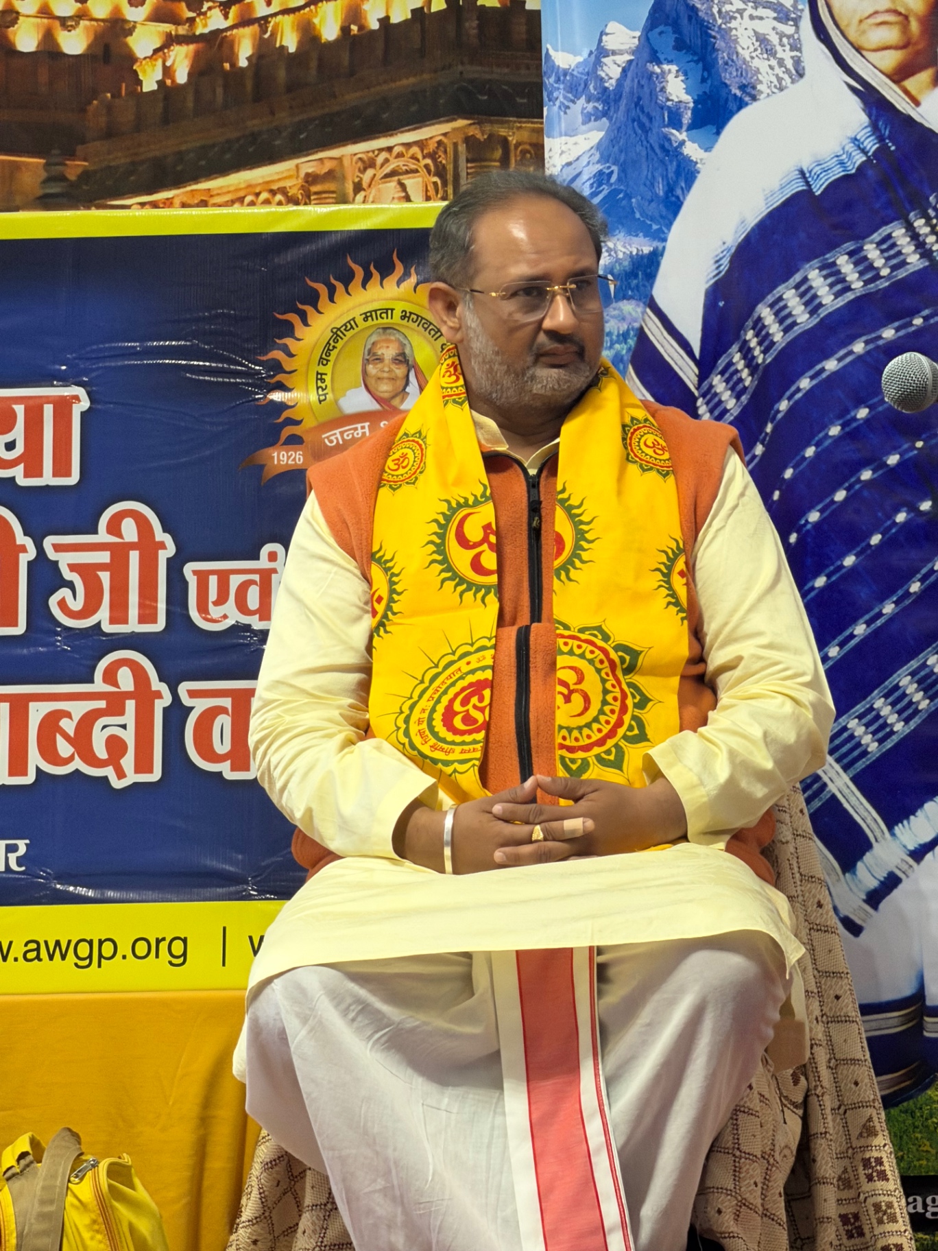 Dr. Chinmay Pandya seated at the satsang