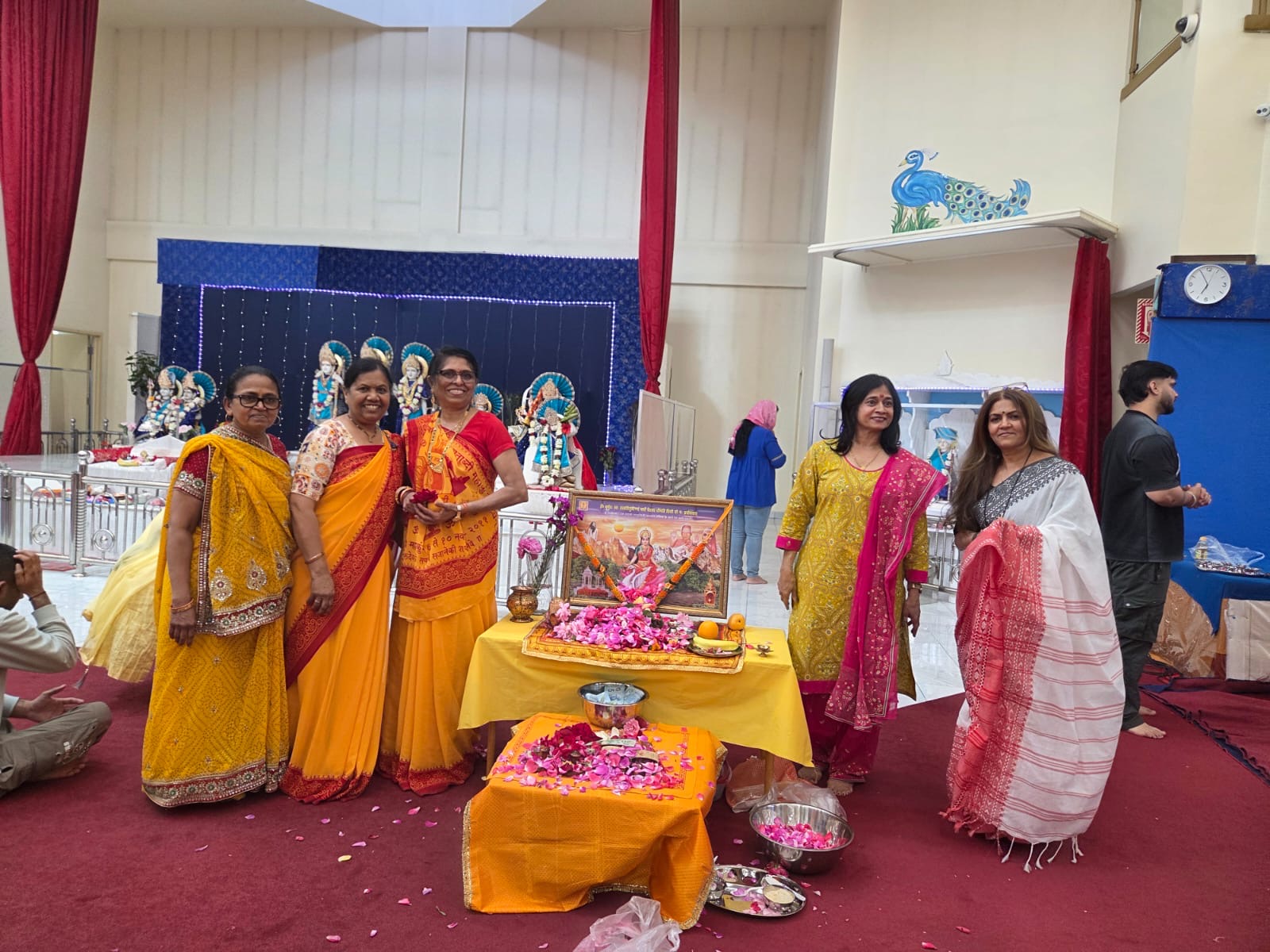 Volunteers beside the Gayatri Mata altar
