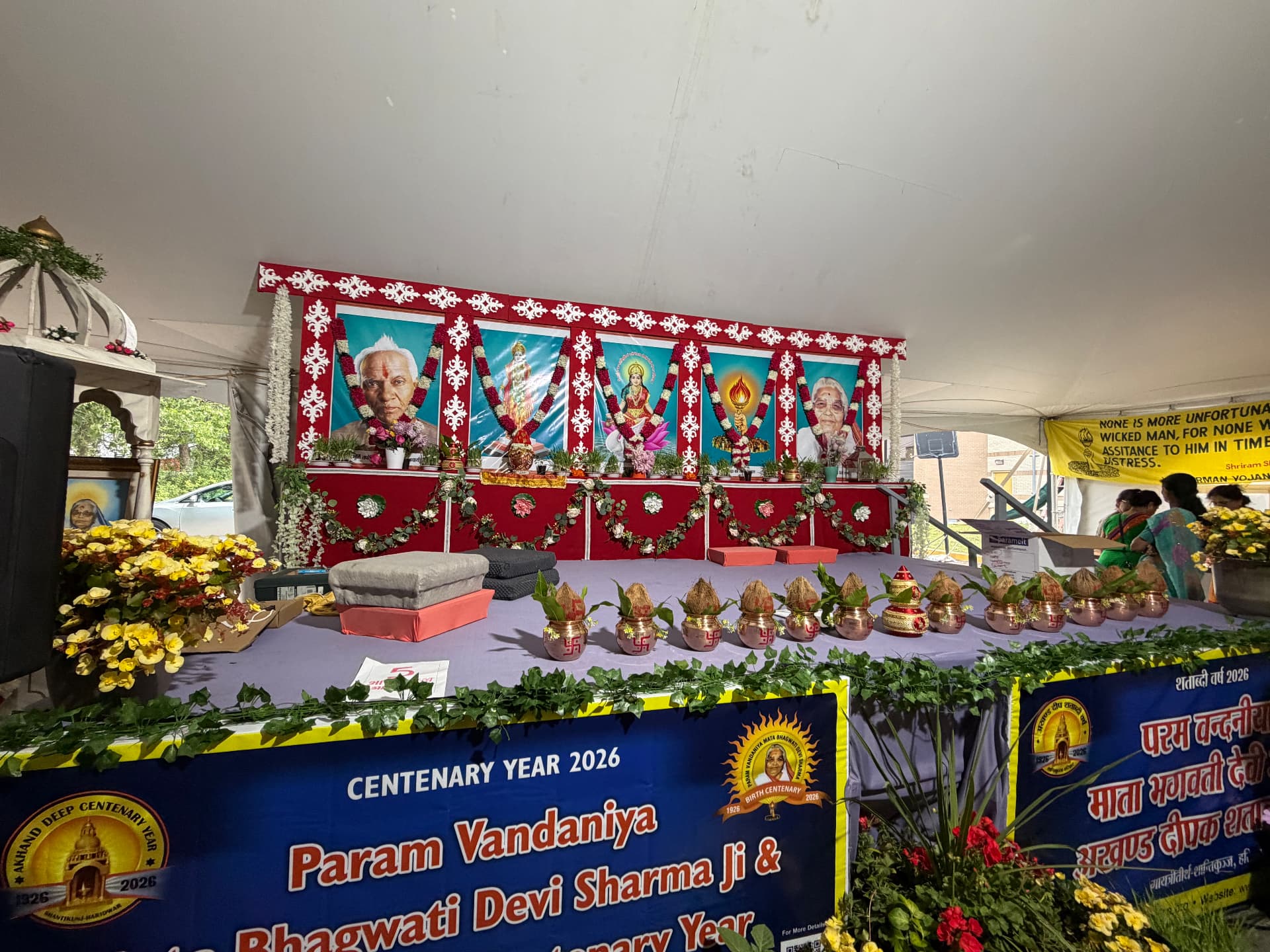 Decorated stage with kalash and Shatabdi Varsh 2026 banner