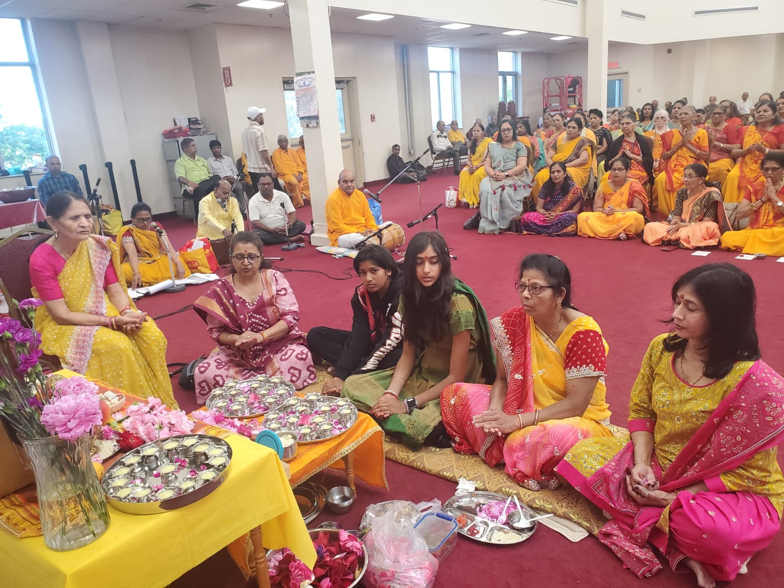 Families performing the deep puja together
