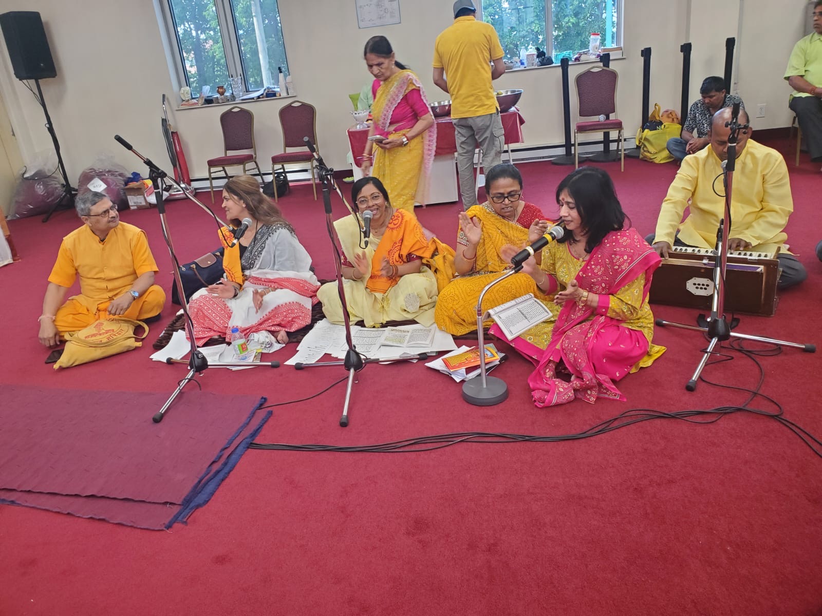 Bhajan singers with harmonium during the satsang