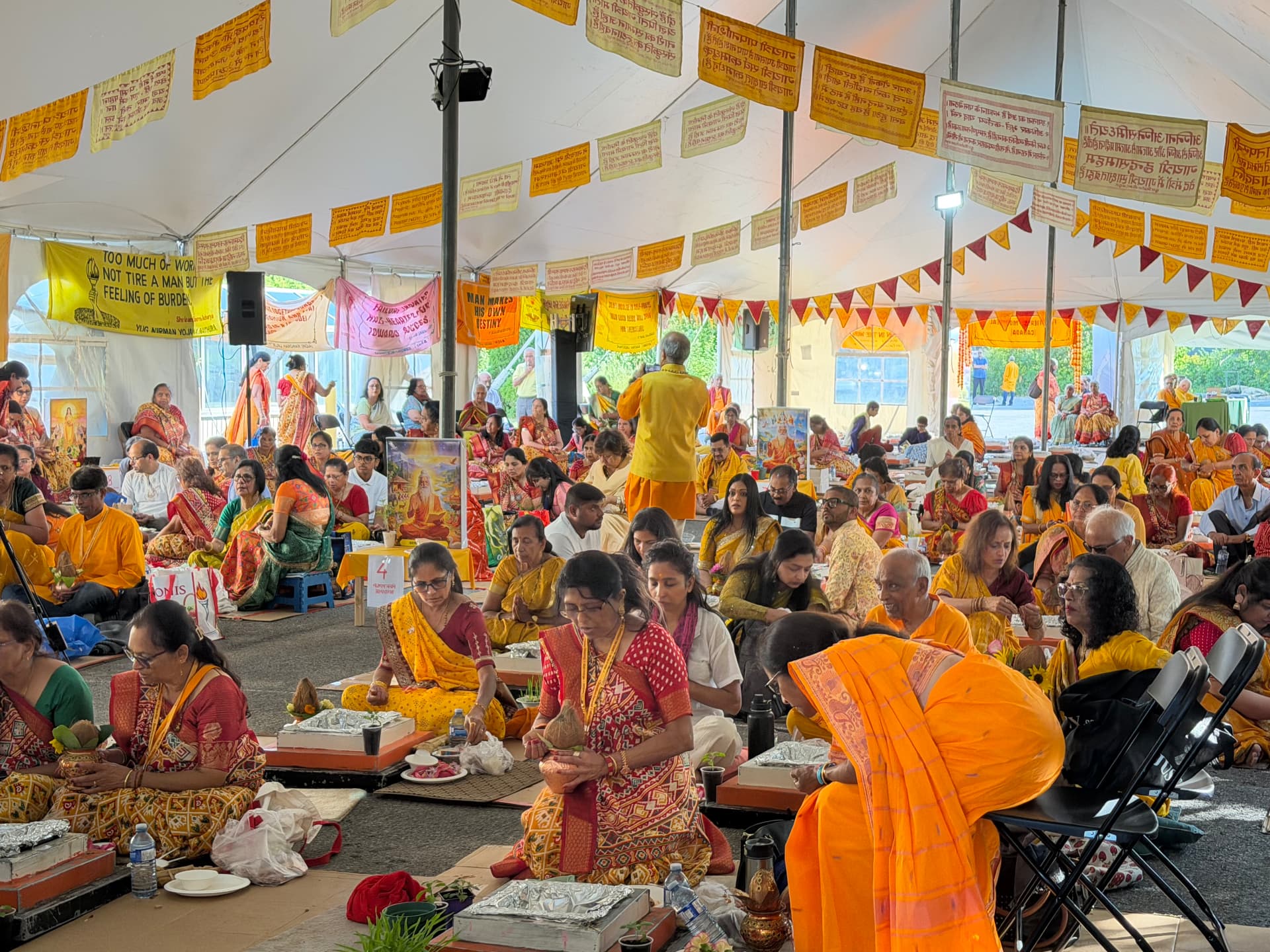 Sadhaks performing the collective puja with kalash